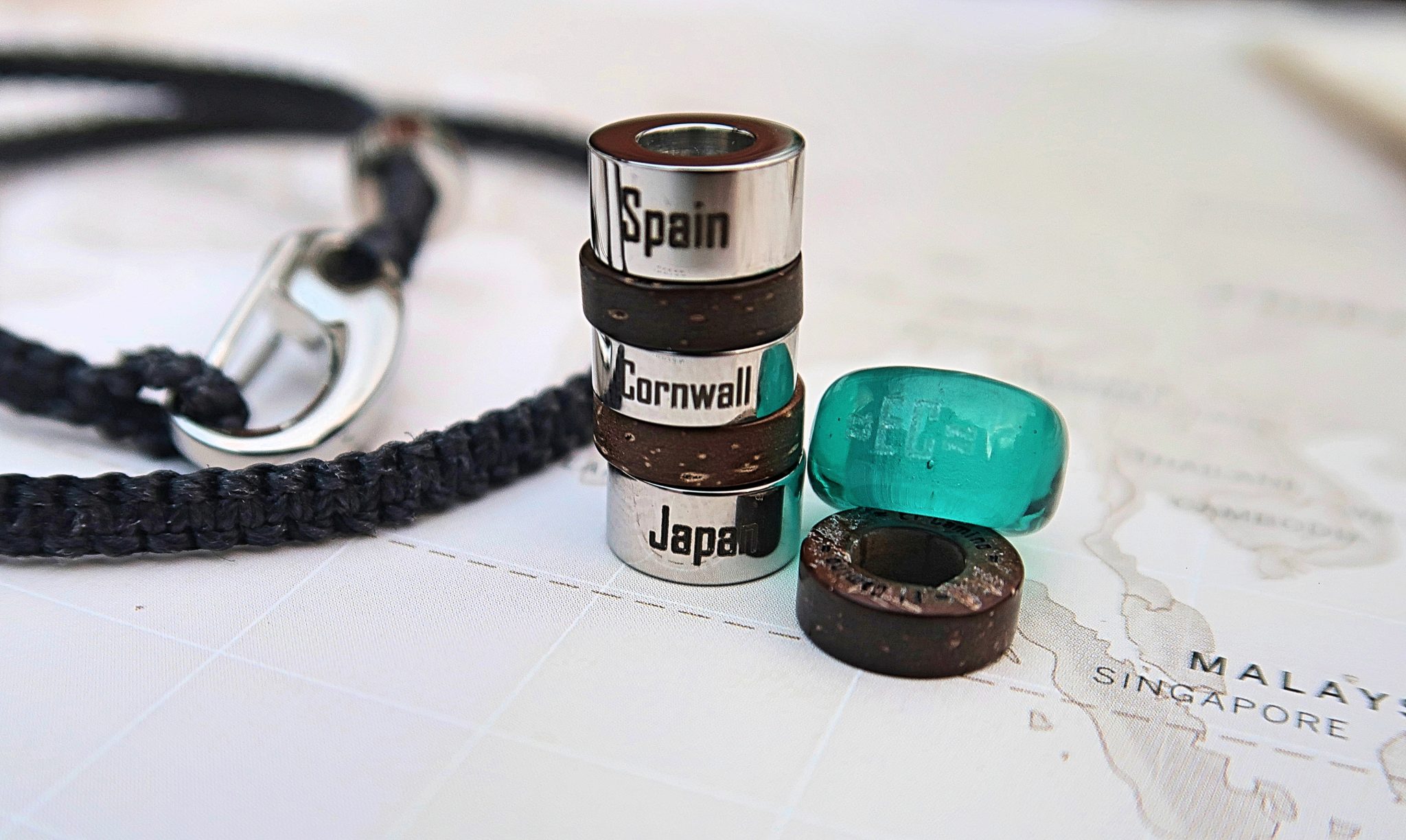 El Camino - close up of steps, spacers and bracelet on map background. 